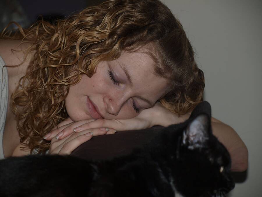 photographer Baron Michael cosplay modelling photo taken at Cambridgeshire. sleepy young woman with cat.