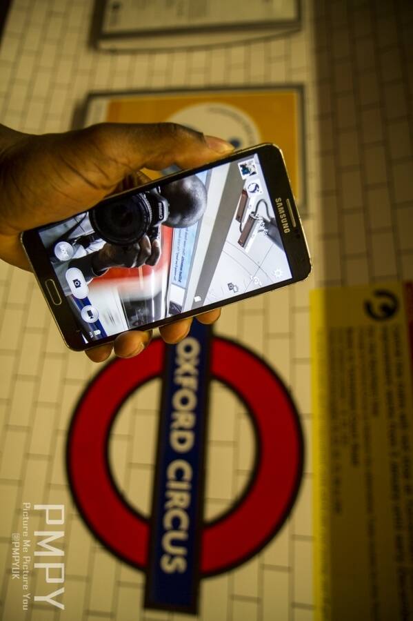 photographer uncleyom lifestyle modelling photo taken at Oxford Circus with Yom. reflections and selfies .