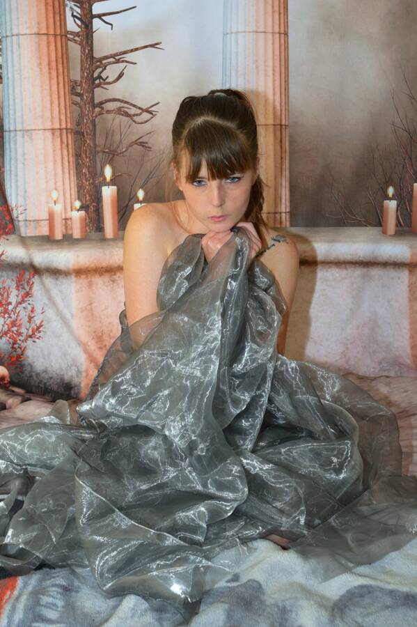 photographer Alan Tog gothic modelling photo. gothic themed shoot nude but covered with a sheer shiny material.