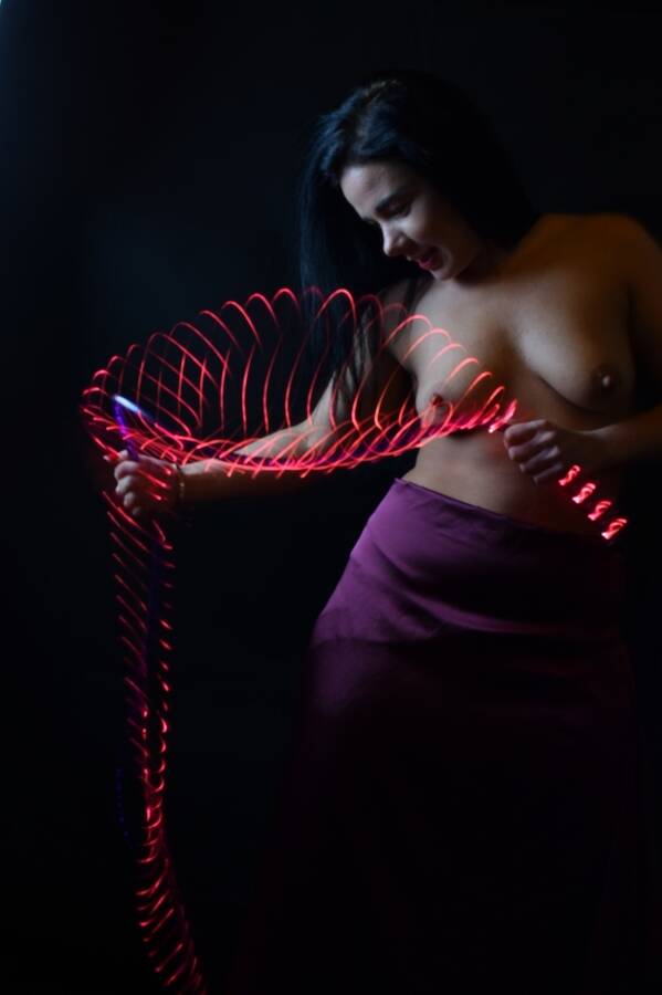 photographer Alan Tog topless modelling photo taken at At models home with @Wendy+Louise+xx . slow exposure to get the movement in the rope light topless model twirling the light.