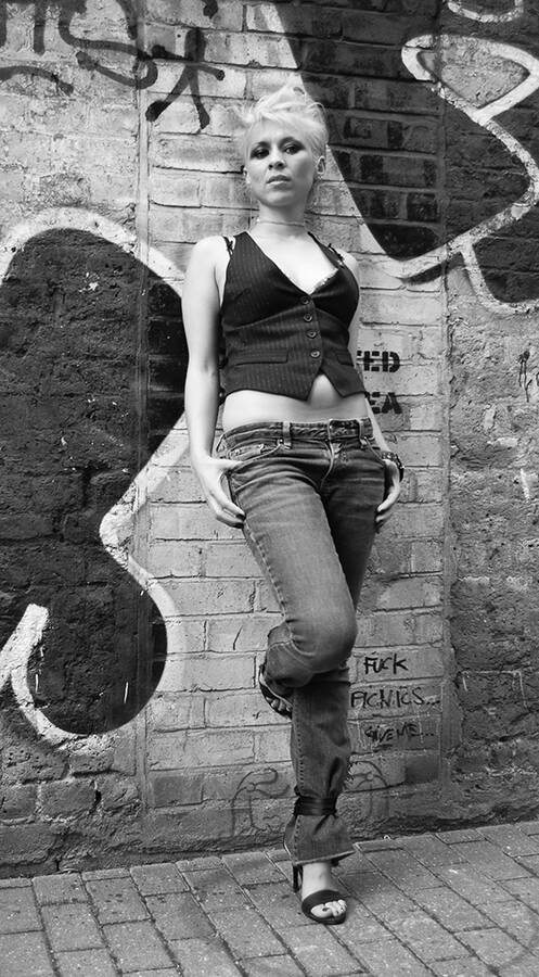 photographer Matchman fashion modelling photo taken at Old Street, London, UK with    Coco. coco leaning against graffitti wall.