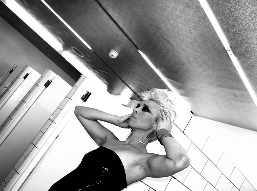 photographer Matchman fashion modelling photo taken at Old Street, London, UK with Coco. in the bathrooms of a pub in old street london.